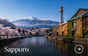Sapporo canal, cherry blossoms and distant mountains
